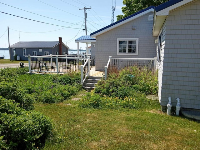 view of yard with a wooden deck