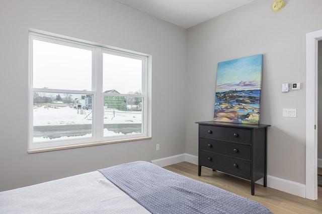 bedroom with light hardwood / wood-style flooring