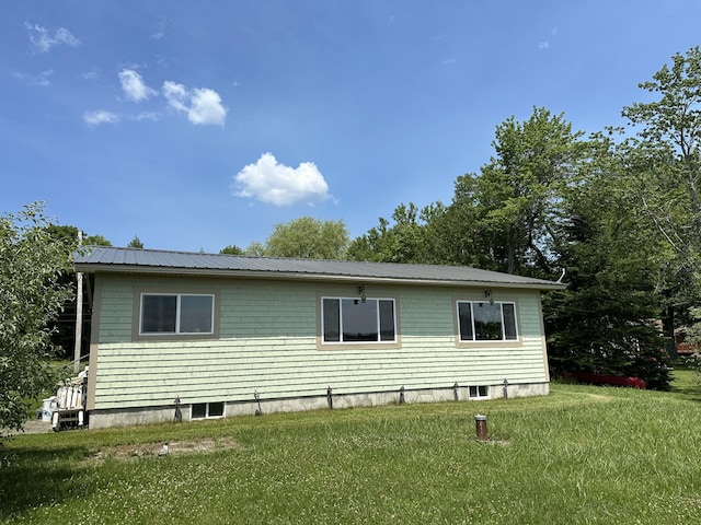 view of home's exterior featuring a lawn