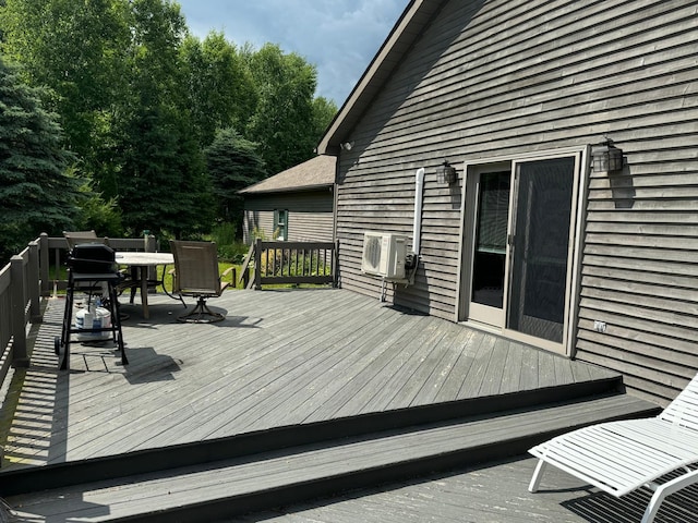 wooden deck featuring ac unit