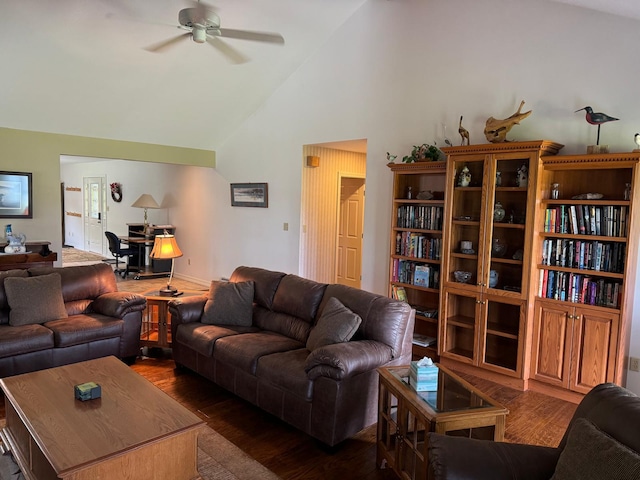 living room with high vaulted ceiling, ceiling fan, and dark hardwood / wood-style flooring