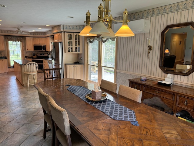 dining space with french doors and tile patterned flooring