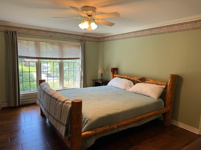 bedroom featuring ceiling fan, ornamental molding, and dark hardwood / wood-style flooring