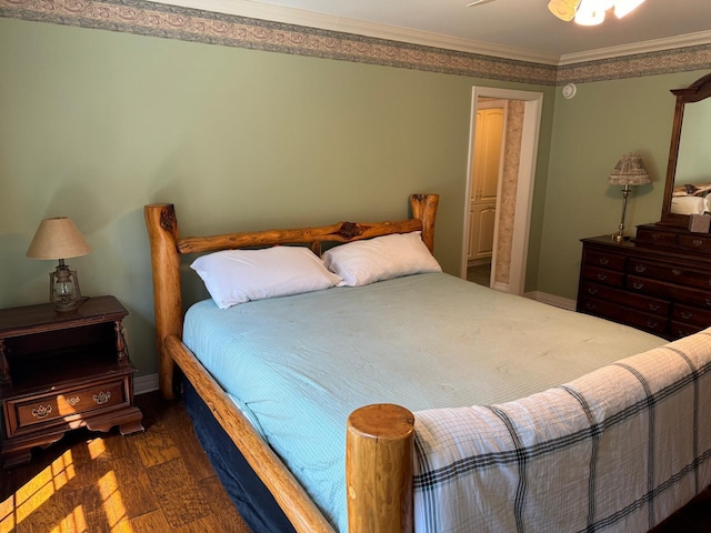 bedroom featuring ceiling fan, crown molding, and dark hardwood / wood-style floors