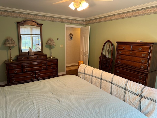 bedroom featuring ceiling fan and crown molding