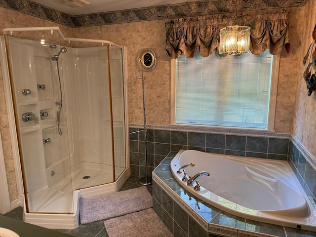 bathroom featuring plus walk in shower and tile patterned flooring