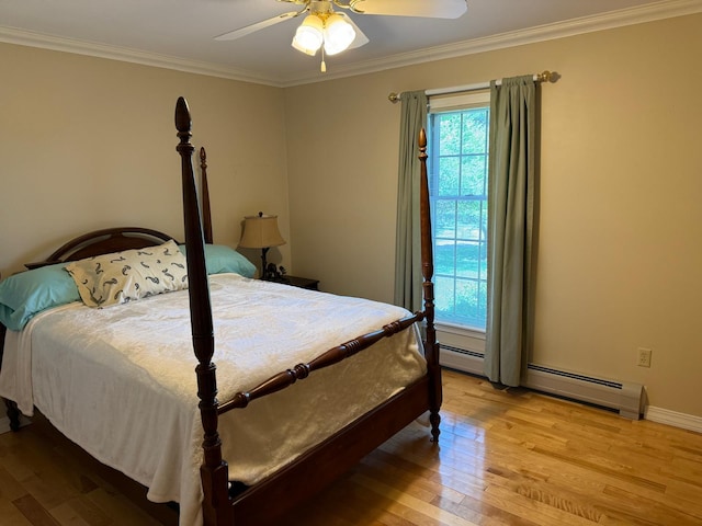 bedroom with ceiling fan, baseboard heating, light hardwood / wood-style flooring, and ornamental molding