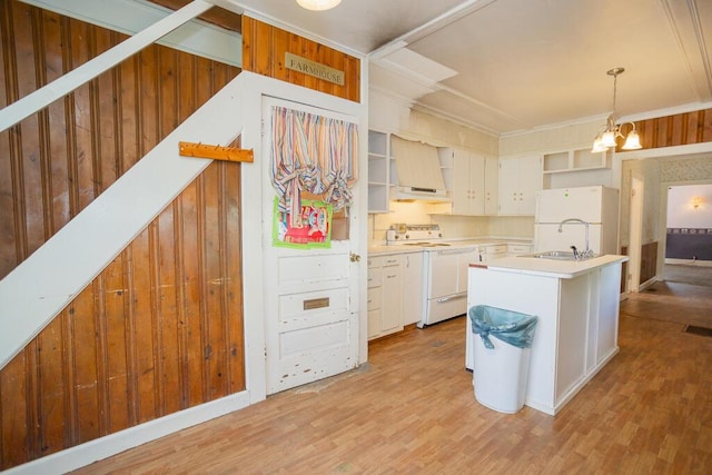 kitchen featuring white cabinetry, white fridge, pendant lighting, and range