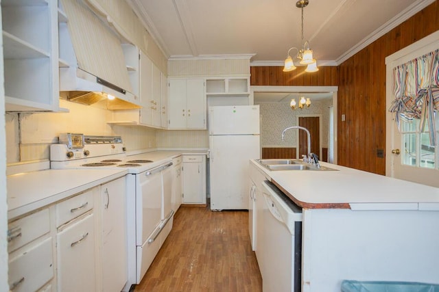 kitchen featuring white appliances, sink, decorative light fixtures, a chandelier, and white cabinetry