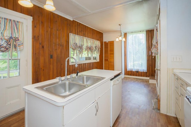 kitchen with a center island with sink, dishwasher, white cabinetry, and sink