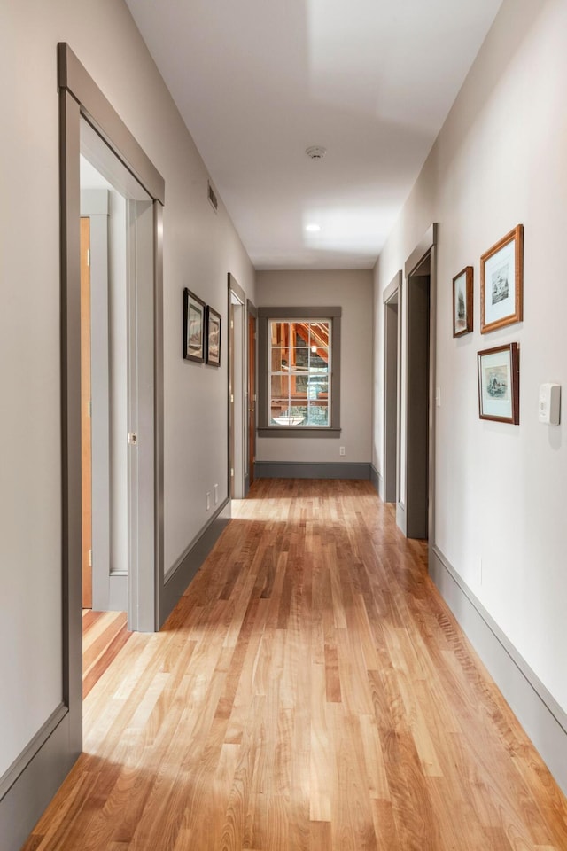 corridor featuring light hardwood / wood-style floors