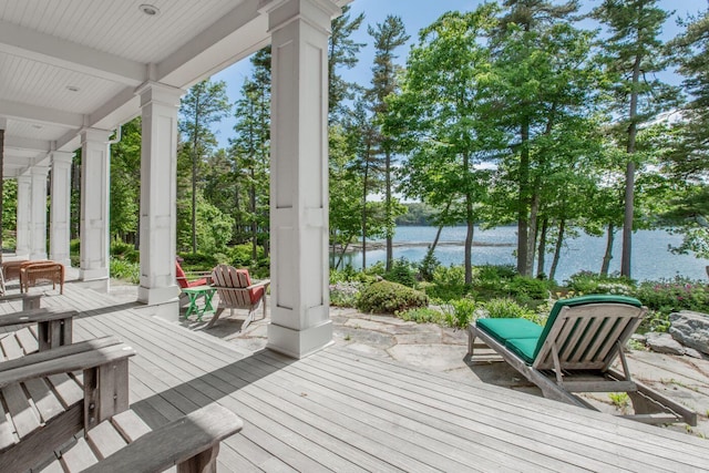 wooden deck with a water view