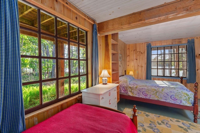 bedroom featuring wooden ceiling and wood walls