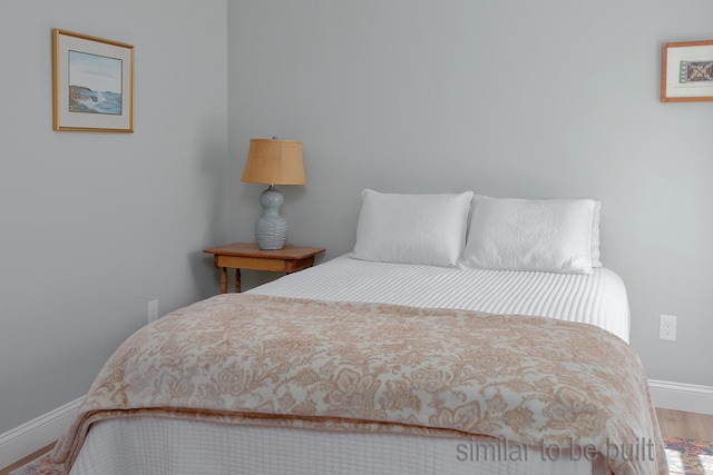 bedroom featuring wood-type flooring