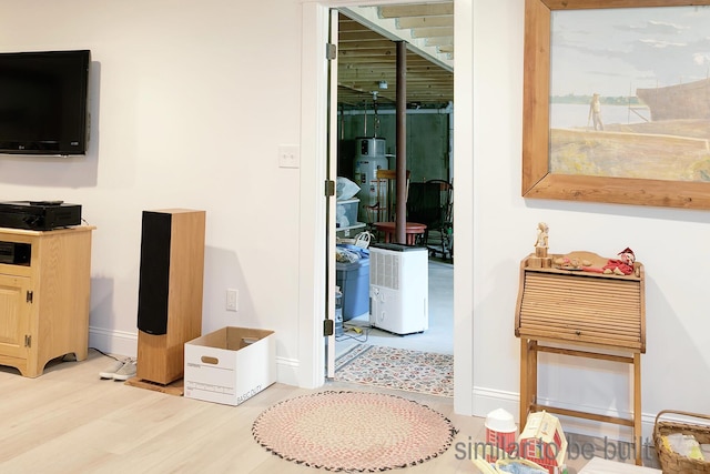 hall featuring water heater and light wood-type flooring