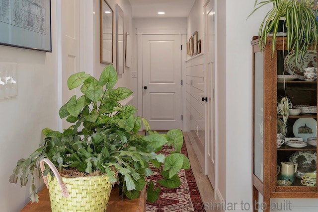 hallway featuring wood-type flooring