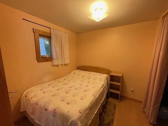 bedroom featuring hardwood / wood-style flooring