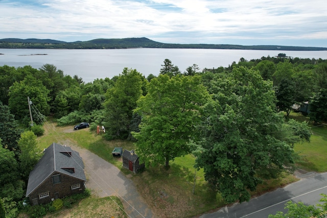 aerial view featuring a water and mountain view