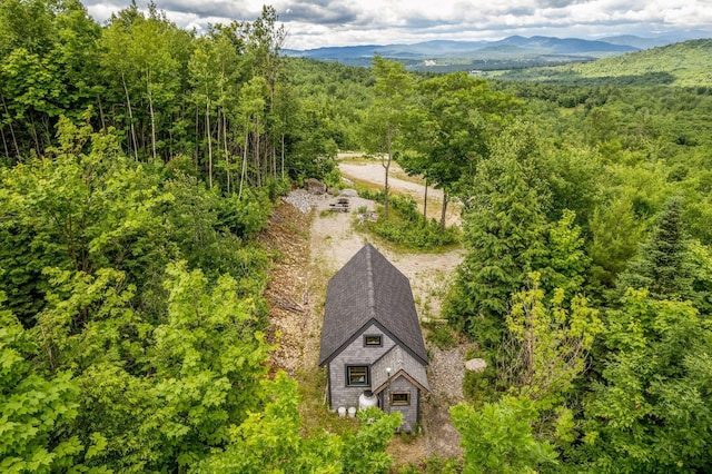 birds eye view of property with a mountain view