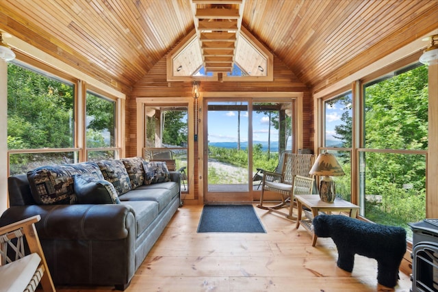 sunroom featuring wooden ceiling and vaulted ceiling