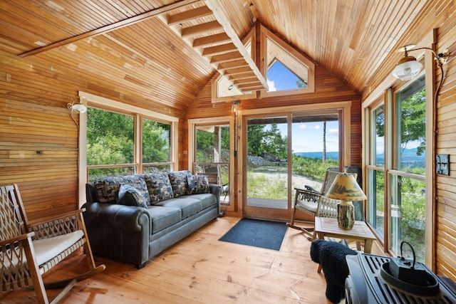 sunroom / solarium featuring lofted ceiling and wooden ceiling