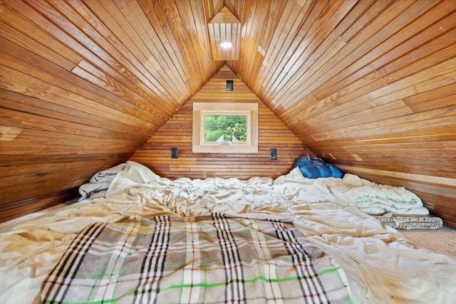 unfurnished bedroom with wooden walls, wood ceiling, and lofted ceiling