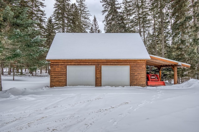 view of snow covered garage