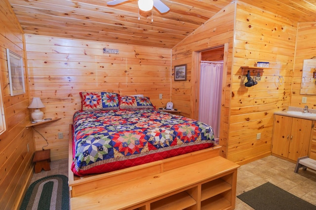 bedroom with wooden walls, ceiling fan, wooden ceiling, vaulted ceiling, and sink