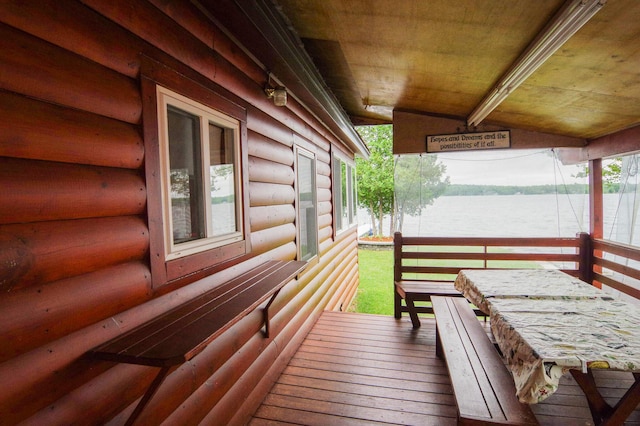 wooden deck with a water view