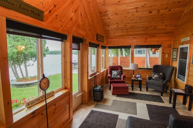 sunroom / solarium with wooden ceiling, lofted ceiling, and a water view