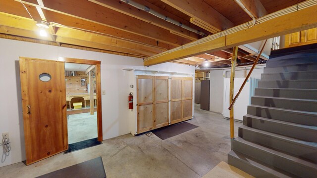 basement with white fridge