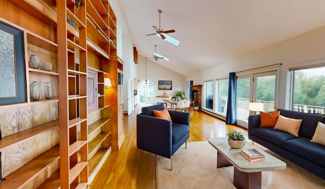 living room featuring high vaulted ceiling, plenty of natural light, hardwood / wood-style floors, and ceiling fan