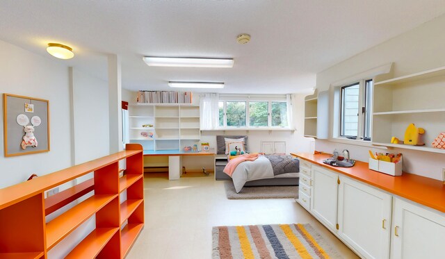 bedroom featuring a baseboard heating unit