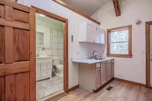 interior space with sink and light hardwood / wood-style flooring