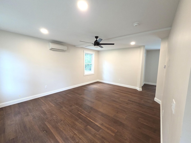 unfurnished room with a ceiling fan, dark wood finished floors, baseboards, and a wall mounted AC