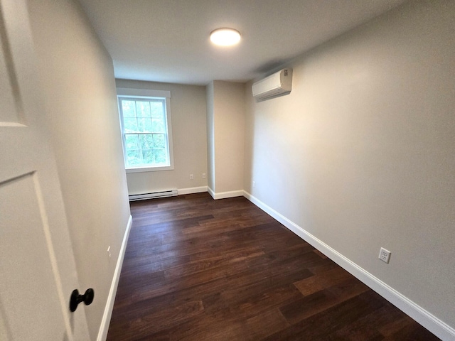 unfurnished room featuring baseboards, baseboard heating, dark wood-style flooring, and a wall mounted AC