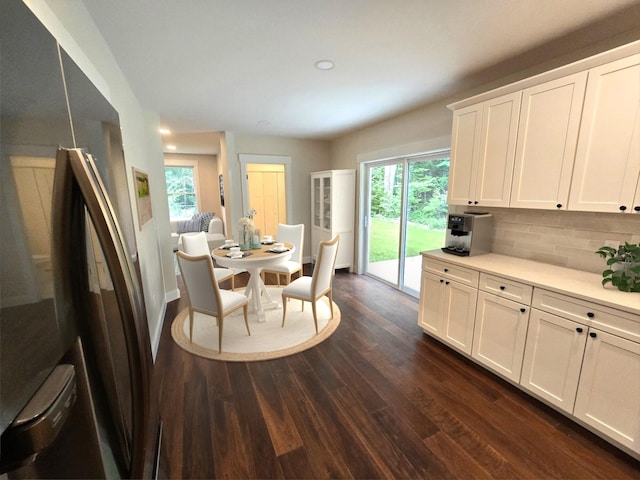 dining space featuring baseboards, dark wood-style flooring, and recessed lighting