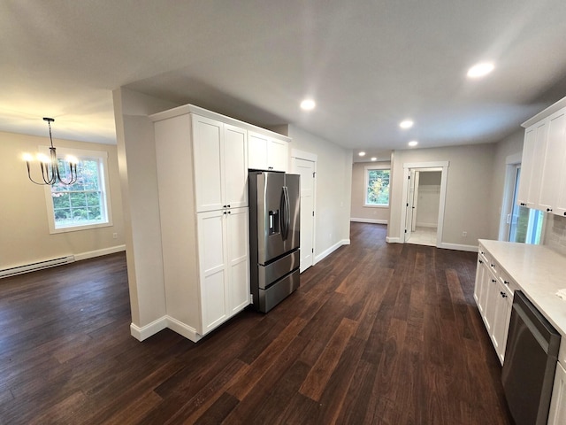 kitchen with recessed lighting, white cabinets, light countertops, appliances with stainless steel finishes, and dark wood finished floors