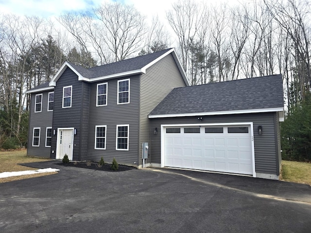 colonial inspired home featuring a garage