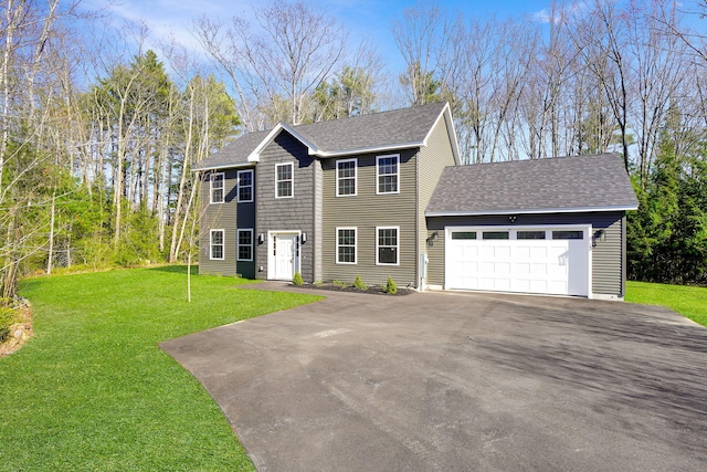 12 Country Dr, Old Orchard Beach, ME 04064 - colonial inspired home featuring asphalt driveway, a garage, a shingled roof, and a front yard