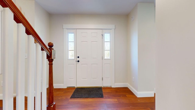 12 Country Dr, Old Orchard Beach, ME 04064 - foyer entrance featuring wood finished floors, baseboards, and stairway
