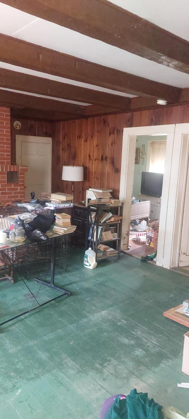 miscellaneous room with hardwood / wood-style flooring and beamed ceiling