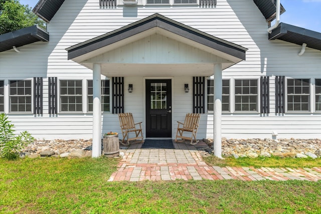 doorway to property featuring a yard