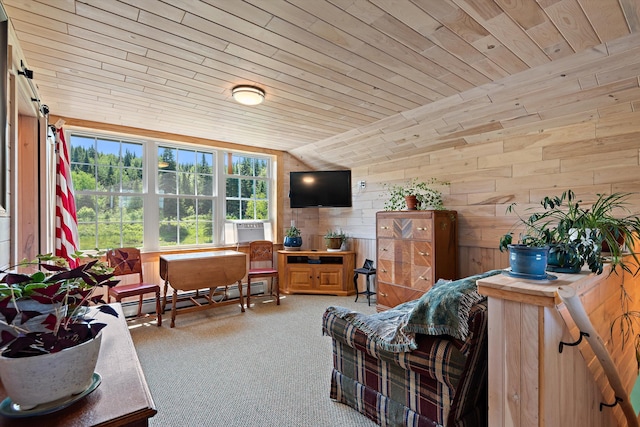 sitting room with vaulted ceiling, wooden walls, carpet flooring, a baseboard heating unit, and wood ceiling