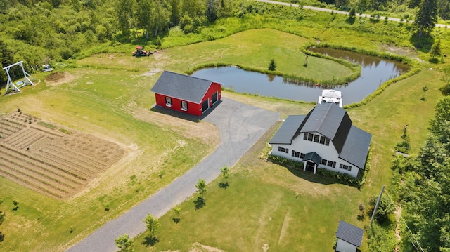 birds eye view of property with a water view and a rural view