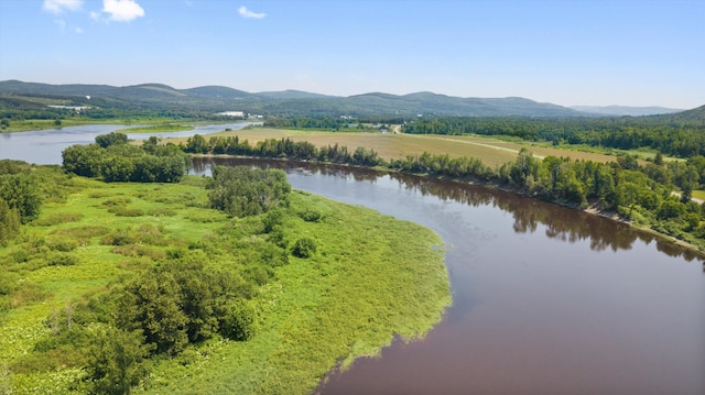 aerial view featuring a water and mountain view