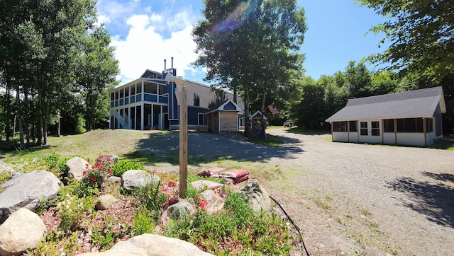 view of yard with a sunroom