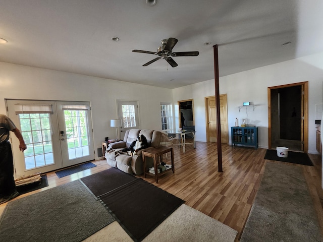 living room featuring ceiling fan, french doors, and hardwood / wood-style floors