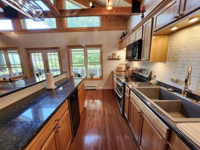 kitchen featuring a baseboard heating unit, black appliances, sink, beamed ceiling, and dark hardwood / wood-style flooring