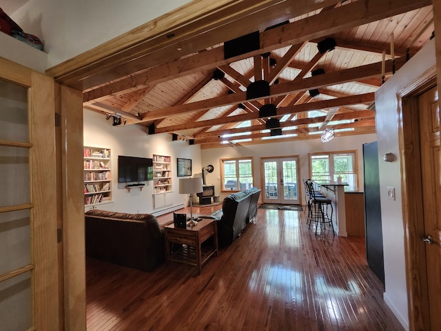 living room featuring hardwood / wood-style floors, beamed ceiling, wood ceiling, high vaulted ceiling, and french doors